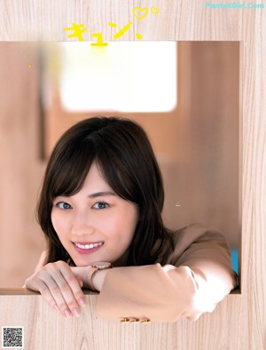 A woman sitting at a table in a restaurant.