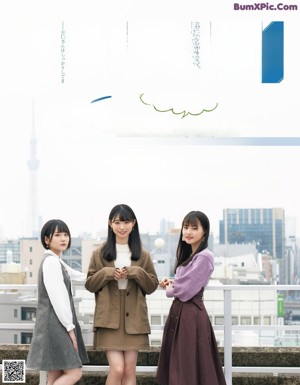 A group of young women in school uniforms posing for a magazine.