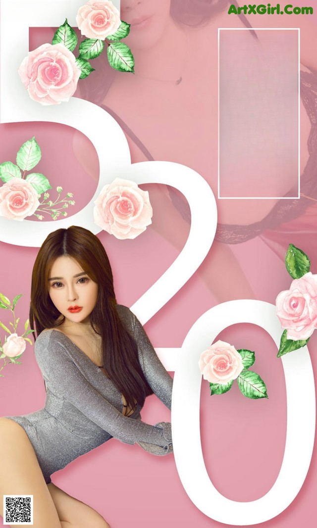 A woman in a gray bodysuit sitting on a pink background.