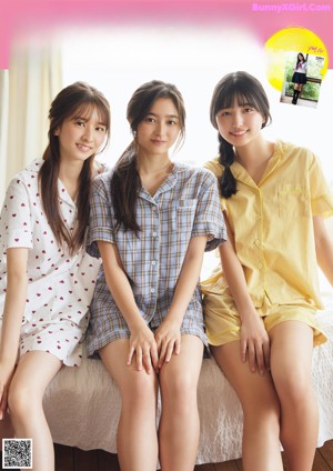 A group of young women in school uniforms posing for a magazine.