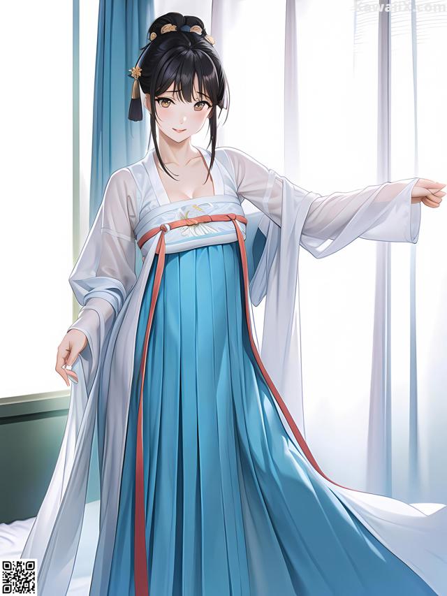 A woman in a blue and white dress standing in front of a window.